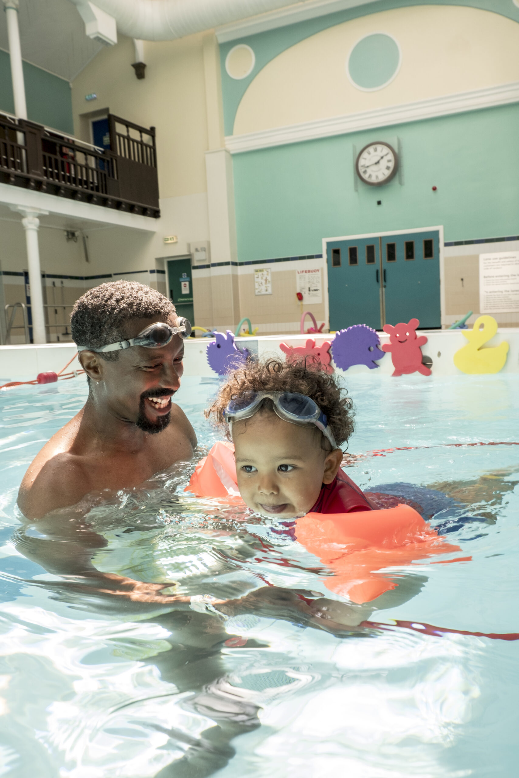 A toddler with inflatable armbands on, enjoys a swim. Picture courtesy of Edinburgh Leisure.